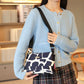 Crossbodytas met meerdere zakken en print voor dames