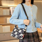 Crossbodytas met meerdere zakken en print voor dames