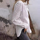 Opengewerkte witte blouse met leeg patroon