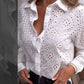 Opengewerkte witte blouse met leeg patroon