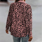 Damesjas met lange mouwen en luipaardprint en knopen