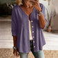 Damesblouse met V-hals, kanten rand en knopen
