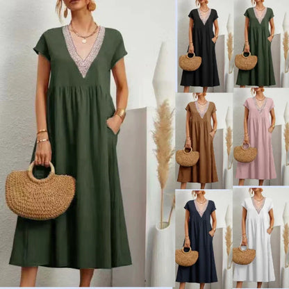 Elegante damesjurk met V-hals, korte mouwen en een losse pasvorm