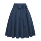 Damesrok met plooien en hoge taille, voorzien van een strik