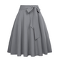 Damesrok met plooien en hoge taille, voorzien van een strik