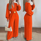 Elegante jumpsuit met V-hals, wijde pijpen en riem