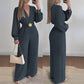 Elegante jumpsuit met V-hals, wijde pijpen en riem