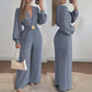 Elegante jumpsuit met V-hals, wijde pijpen en riem