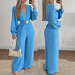 Elegante jumpsuit met V-hals, wijde pijpen en riem