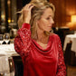Elegante damesjurk met gedrapeerde halslijn en paillettenmouwen