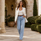 Dames stretch wide-leg jeans met ruwe zoom