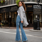 Dames high-waisted distressed flare jeans