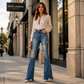 Dames high-waisted distressed flare jeans