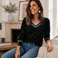 Elegant gebreid dames shirt met V-hals en contrastdetail