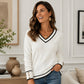 Elegant gebreid dames shirt met V-hals en contrastdetail