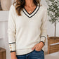 Elegant gebreid dames shirt met V-hals en contrastdetail