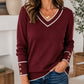 Elegant gebreid dames shirt met V-hals en contrastdetail