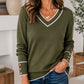 Elegant gebreid dames shirt met V-hals en contrastdetail