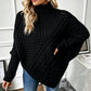 Damesgebreide ponchotrui met kabelpatroon